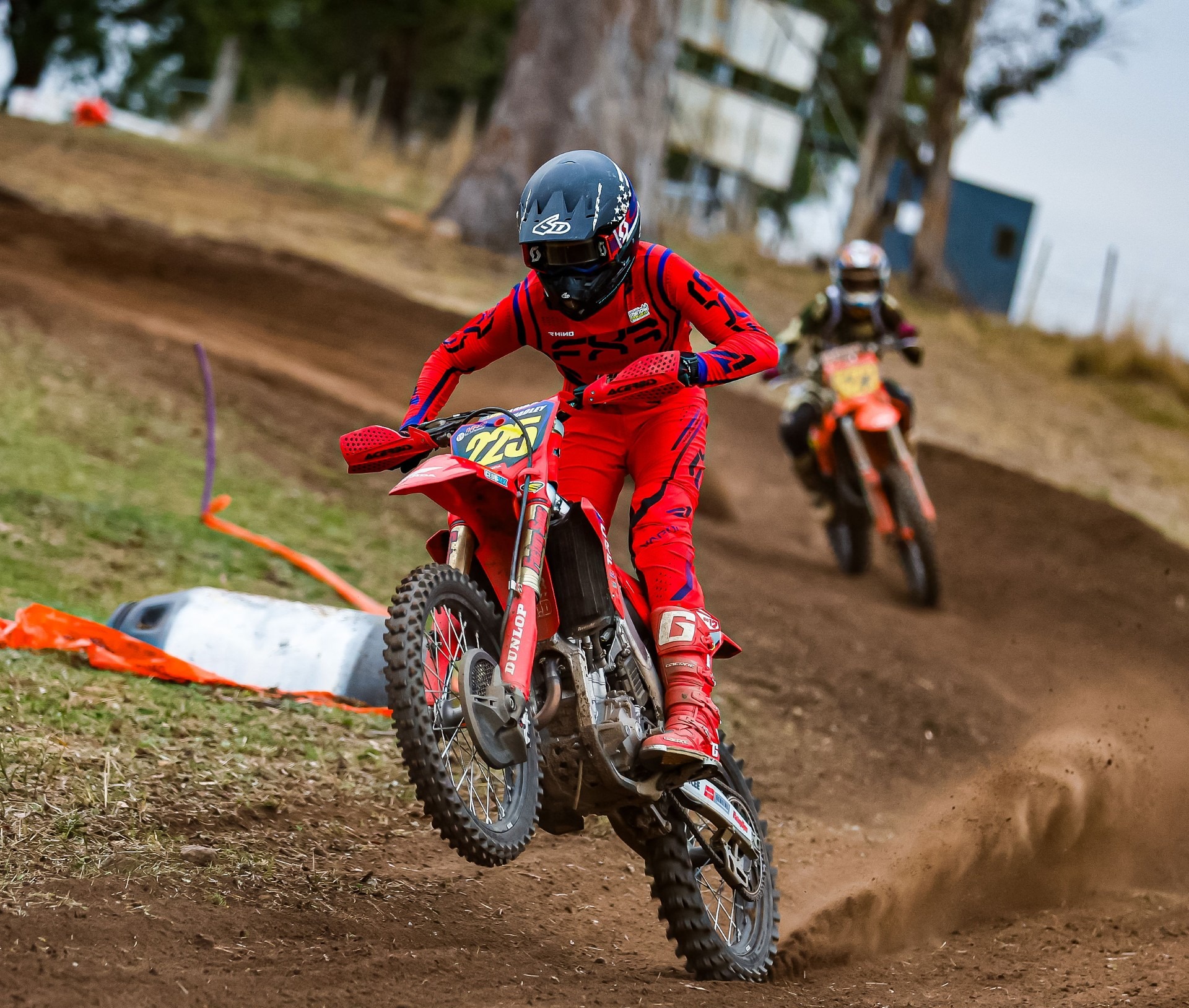 Motocross athlete tackling jumps with Moto Coach coaching support